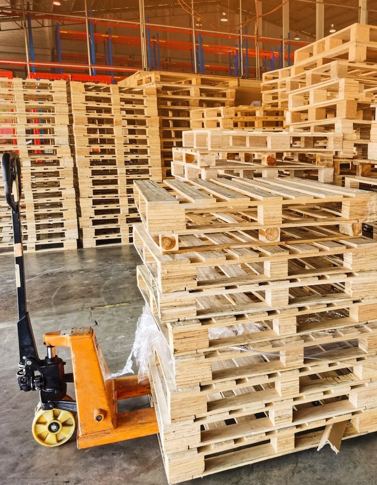 Wooden pallets stack at the freight cargo warehouse storage for shipment box container in transportation and logistics industrial